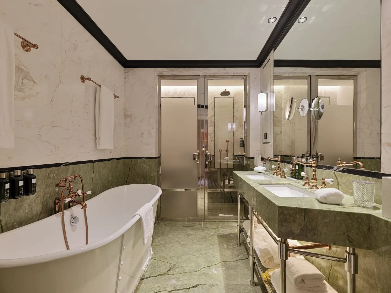 The One Monumental Palace: A marble bathroom with a freestanding bath